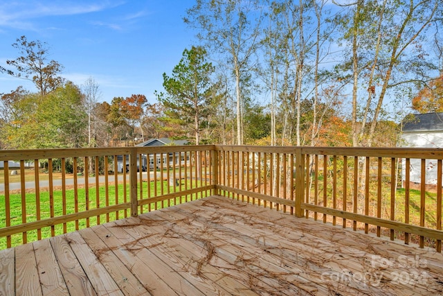 wooden deck with a yard