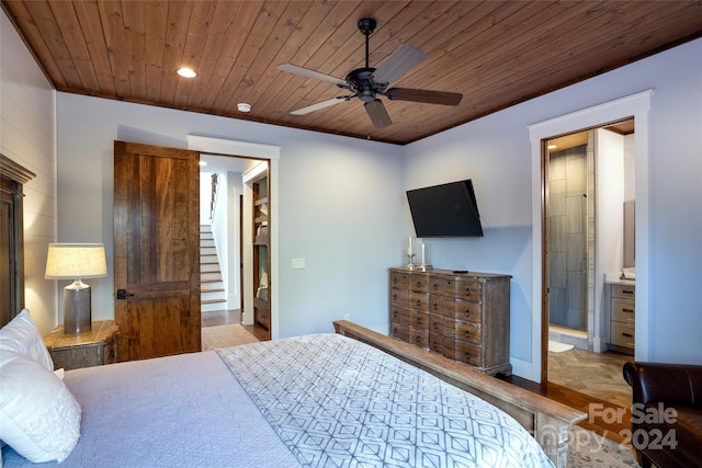 bedroom with ensuite bathroom, ceiling fan, and wooden ceiling