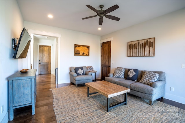 living room featuring dark hardwood / wood-style floors and ceiling fan