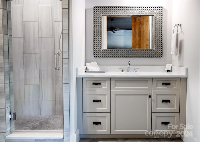 bathroom with vanity and an enclosed shower