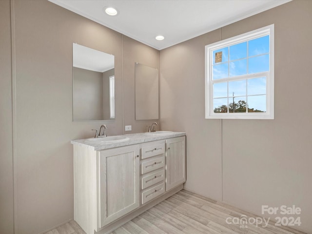 bathroom featuring hardwood / wood-style floors and vanity