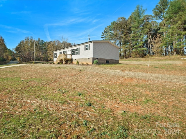 view of property exterior featuring a yard