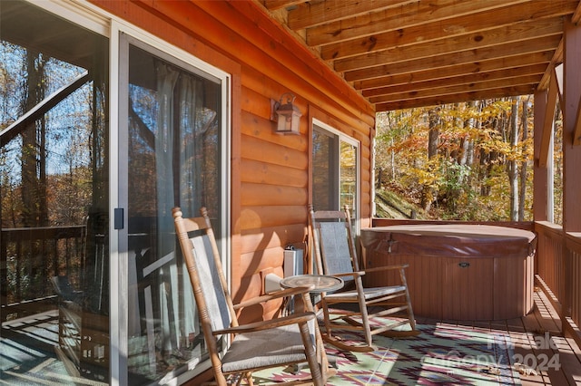 unfurnished sunroom with a jacuzzi