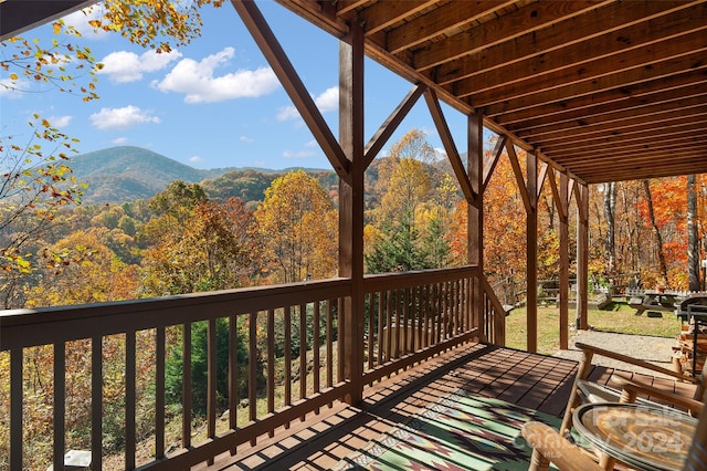 wooden terrace featuring a mountain view