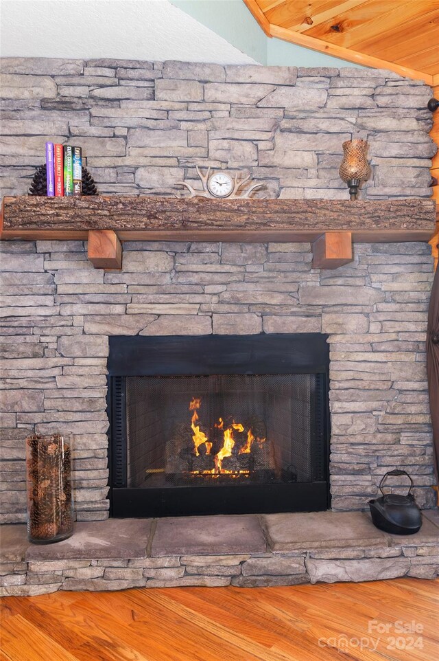 interior details with a fireplace and hardwood / wood-style floors