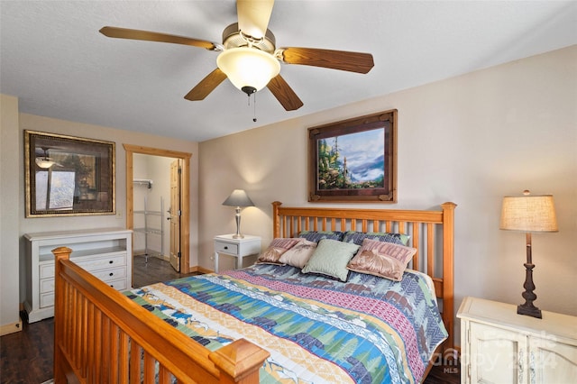 bedroom featuring dark hardwood / wood-style flooring and ceiling fan