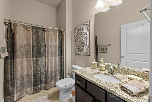 bathroom featuring vanity, a shower with shower curtain, and toilet