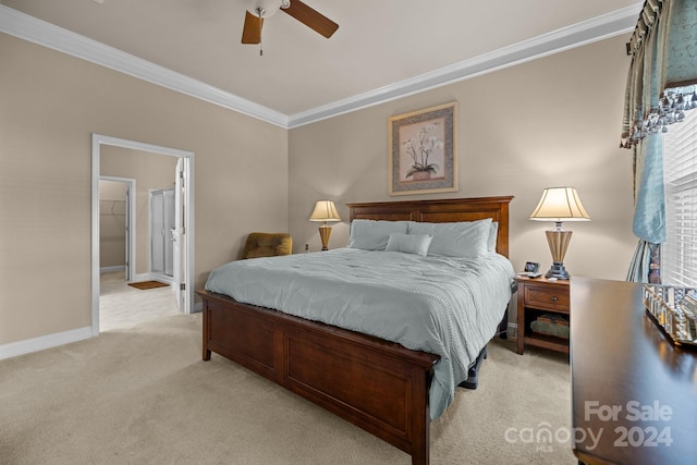 carpeted bedroom featuring a closet, ceiling fan, crown molding, and a spacious closet