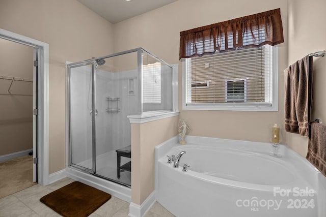 bathroom featuring tile patterned floors and plus walk in shower