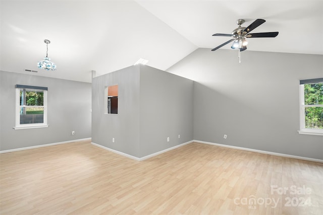 interior space featuring ceiling fan, lofted ceiling, and light hardwood / wood-style flooring