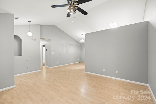 unfurnished living room with ceiling fan, high vaulted ceiling, and light hardwood / wood-style floors