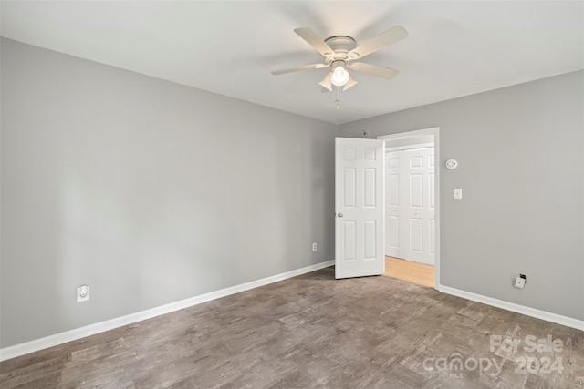 unfurnished bedroom featuring ceiling fan and hardwood / wood-style floors