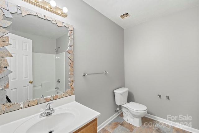 full bathroom with vanity, toilet, and washtub / shower combination