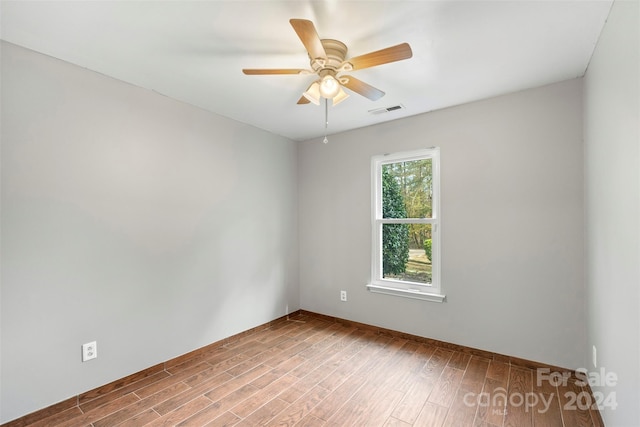 unfurnished room featuring ceiling fan and light hardwood / wood-style flooring