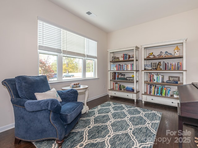 sitting room with dark hardwood / wood-style floors