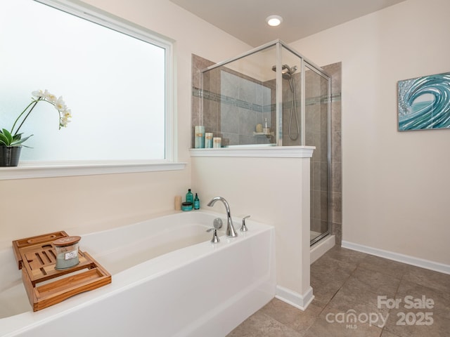 bathroom featuring tile patterned floors and plus walk in shower