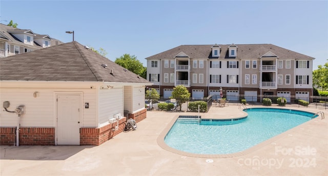 view of pool featuring a patio