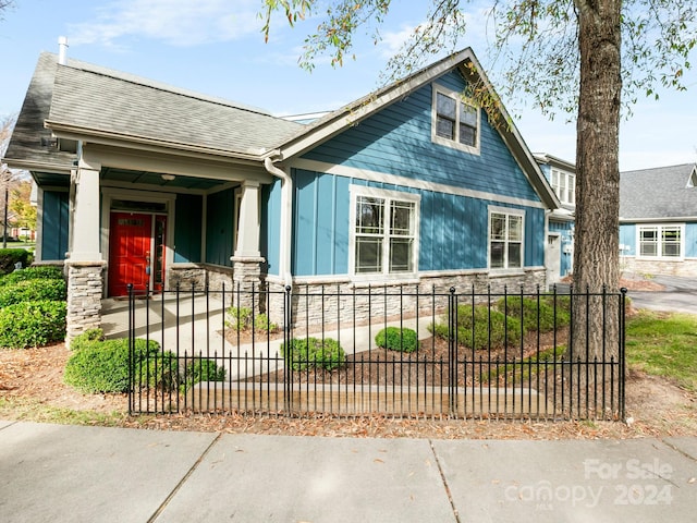 view of side of home with a porch