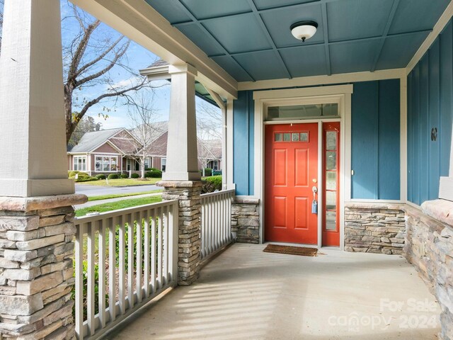 60 Westfield Way, Candler, NC 28715 - doorway to property with a porch, stone siding, and board and batten siding
