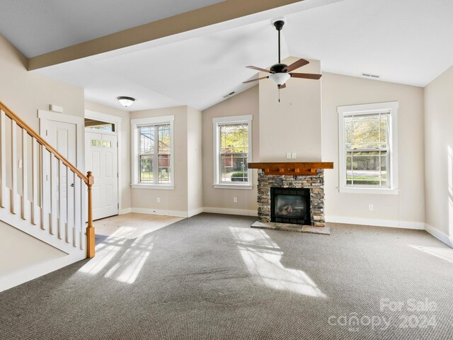 60 Westfield Way, Candler, NC 28715 - unfurnished living room with carpet flooring, a fireplace, baseboards, vaulted ceiling, and a ceiling fan
