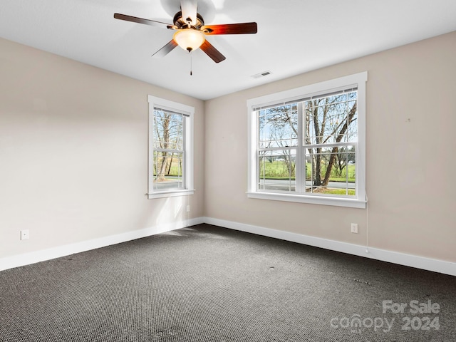 carpeted empty room with ceiling fan