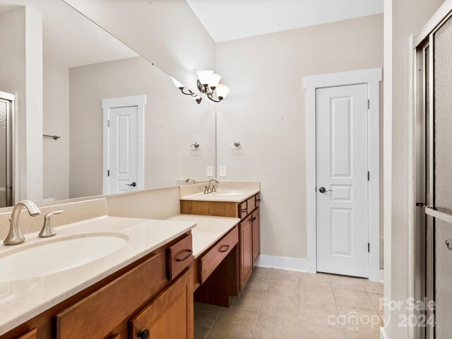 60 Westfield Way, Candler, NC 28715 - bathroom with tile patterned flooring, a shower stall, vanity, and baseboards