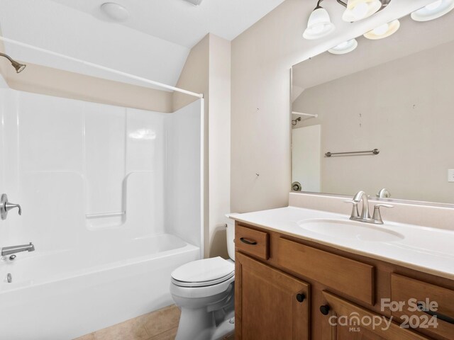 60 Westfield Way, Candler, NC 28715 - bathroom with toilet, washtub / shower combination, tile patterned floors, vanity, and vaulted ceiling