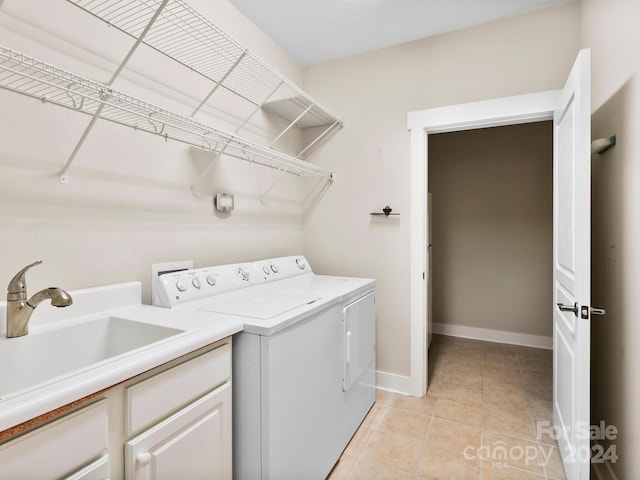 60 Westfield Way, Candler, NC 28715 - laundry area featuring washing machine and clothes dryer, light tile patterned floors, and baseboards