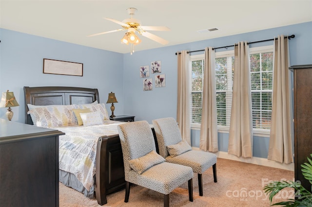 bedroom featuring light carpet and ceiling fan