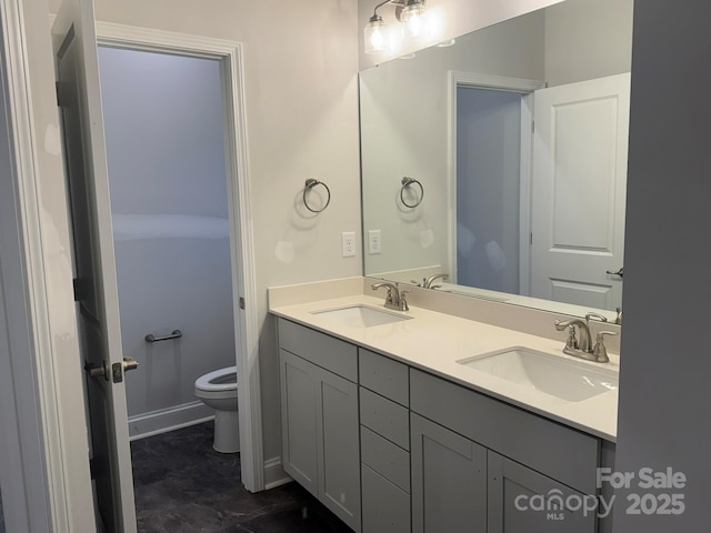 bathroom with vanity and toilet