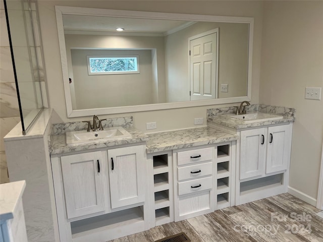 51 Rosemont Dr, Stony Point, NC 28678 - full bathroom with two vanities, ornamental molding, wood finished floors, and baseboards