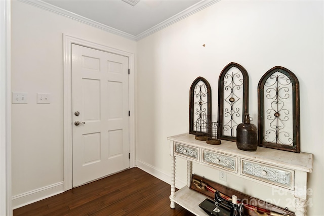 foyer with ornamental molding and dark wood-type flooring