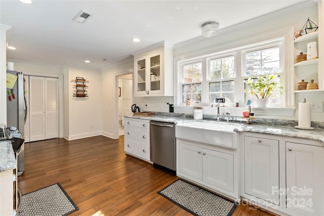 kitchen featuring white cabinets, sink, dark hardwood / wood-style floors, light stone countertops, and stainless steel appliances