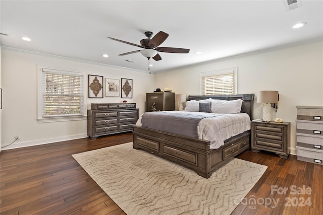 bedroom featuring ceiling fan, dark hardwood / wood-style floors, and ornamental molding