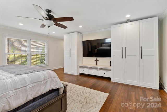 bedroom featuring ceiling fan, dark hardwood / wood-style flooring, and ornamental molding