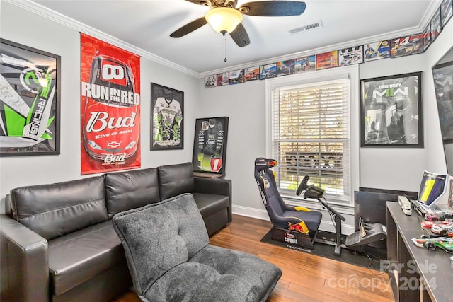 office space with wood-type flooring, ceiling fan, and crown molding