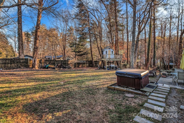 view of yard featuring a hot tub and a patio area