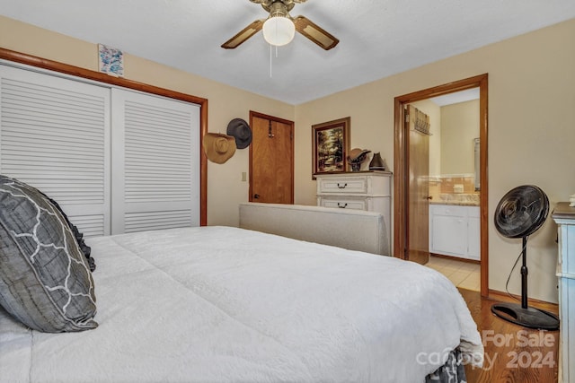 bedroom with connected bathroom, ceiling fan, a closet, and light wood-type flooring