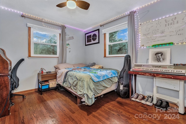 bedroom featuring hardwood / wood-style floors and ceiling fan