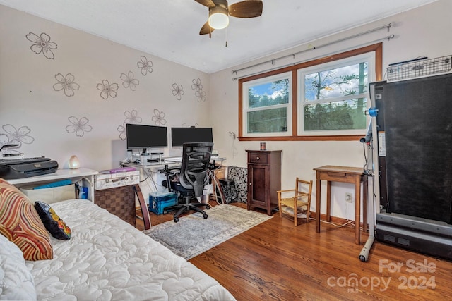 bedroom featuring ceiling fan and wood-type flooring