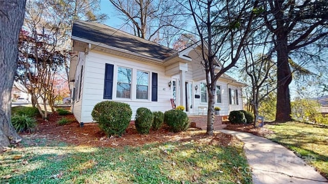 bungalow with a front lawn