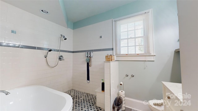 bathroom featuring tile patterned floors, toilet, and plus walk in shower