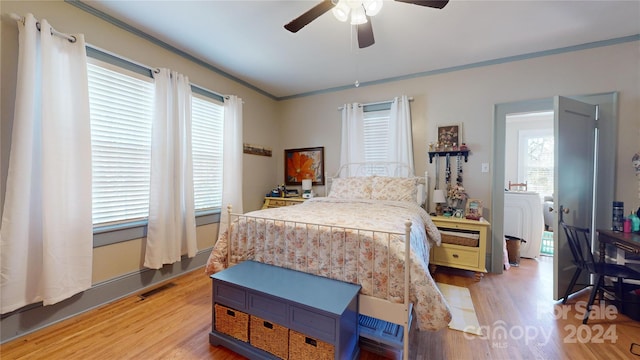 bedroom featuring light hardwood / wood-style floors, ceiling fan, and ornamental molding