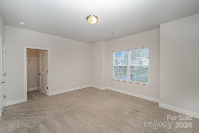 spare room with light carpet