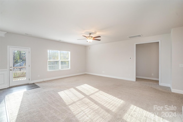 carpeted empty room with ceiling fan