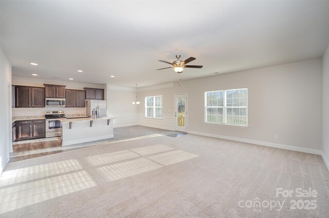 159 Rubys Way Unit 35, Oakboro, NC 28129 - unfurnished living room featuring a ceiling fan, light carpet, and recessed lighting