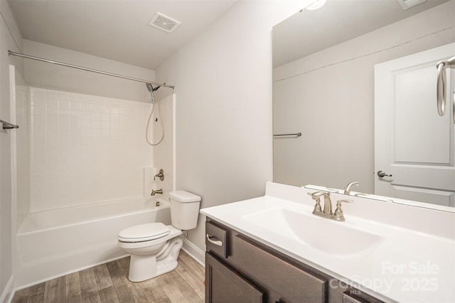 159 Rubys Way Unit 35, Oakboro, NC 28129 - full bathroom with toilet, wood finished floors, vanity, baseboards, and washtub / shower combination