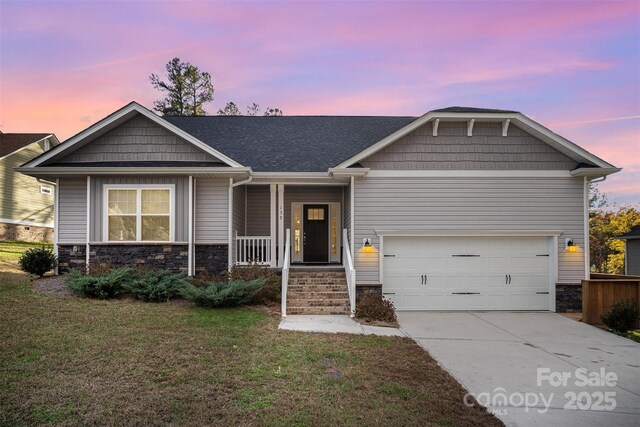 159 Rubys Way Unit 35, Oakboro, NC 28129 - view of front facade featuring driveway, a porch, a front yard, and stone siding