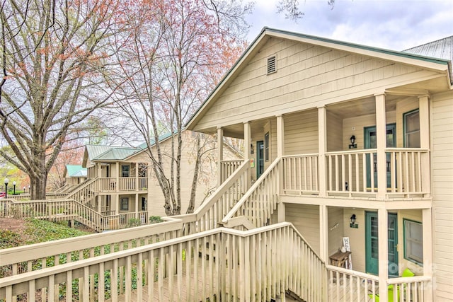 rear view of property with a porch