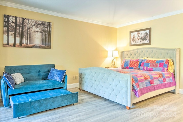 bedroom with wood-type flooring and crown molding